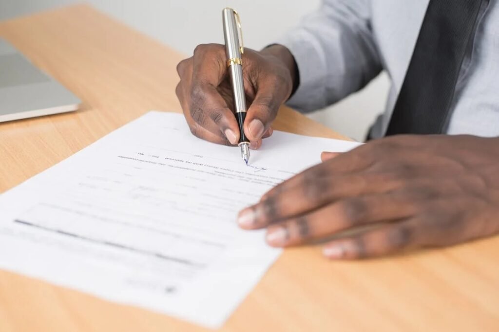 man signing certificate of destruction