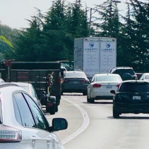 road with cares and trucks and shred truck in distant