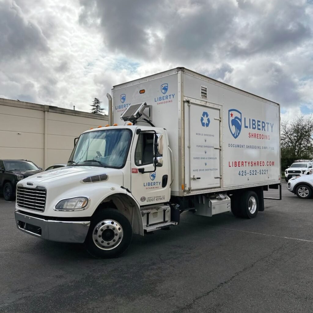 A image of Liberty Shredding's shred truck in a parking lot