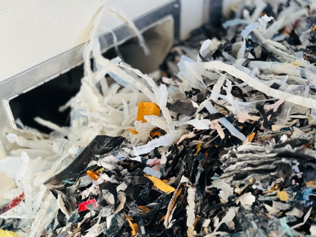 shredded mylar in a shred truck